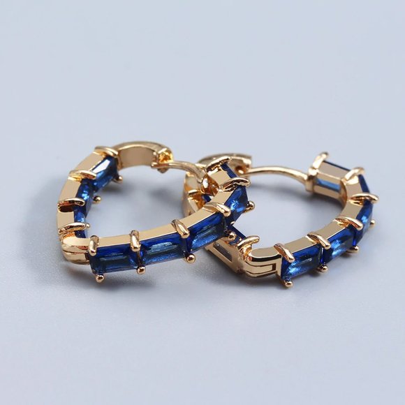 Blue crystal heart shaped earrings with gold base. - Picture 3 of 3